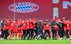 Bayern Munich's players and team members celebrate after they won the German Bundesliga soccer match between Bayern Munich and Borussia Moenchengladbach at the Allianz Arena stadium in Munich, Germany, Saturday, May 8, 2021. (Peter Kneffel/Pool via AP)