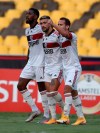 Giorgian Arrascaeta of Brazil's Flamengo, center, celebrates scoring his side's opening goal with teammates against Ecuador's Barcelona during a Copa Libertadores soccer match in Guayaquil, Ecuador, Tuesday, Sept. 22, 2020. (AP Photo/Dolores Ochoa, Pool)