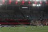 Brazil's Flamengo and Argentina's Racing Club players keep a minute of silence for EFE photographer Marcelo Sayao prior a Copa Libertadores round of 16 second leg soccer match at the Maracana stadium in Rio de Janeiro, Brazil, Tuesday, Dec.1, 2020. (Antonio Lacerda/Pool via AP)