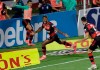 Flamengo's Bruno Henrique, center, scores his side's opening goal against Sao Paulo during the Brazilian championship final soccer match at the Morumbi stadium, Sao Paulo, Brazil, Thursday, Feb. 25, 2021. (AP Photo/Andre Penner)