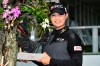 Ariya Jutanugarn of Thailand poses with her trophy for photographers during the award ceremony after winning the LPGA Honda Thailand golf tournament in Pattaya, southern Thailand, Sunday, May 9, 2021. .(AP Photo/Kittinun Rodsupan)