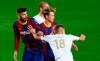 Ferencvaros' David Siger, right, pushes Barcelona's Gerard Pique during the Champions League group G soccer match between FC Barcelona and Ferencvaros at the Camp Nou stadium in Barcelona, Spain, Tuesday, Oct. 20, 2020. (AP Photo/Joan Monfort)