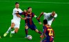 Barcelona's Lionel Messi, center, is stopped by Ferencvaros players during the Champions League group G soccer match between FC Barcelona and Ferencvaros at the Camp Nou stadium in Barcelona, Spain, Tuesday, Oct. 20, 2020. (AP Photo/Joan Monfort)
