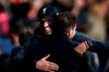 Liverpool's manager Jurgen Klopp , left, hugs Atletico Madrid's head coach Diego Simone before a 1st leg, round of 16, of the Champions League soccer match between Atletico Madrid and Liverpool at the Wanda Metropolitano stadium in Madrid, Tuesday, Feb. 18, 2020. (AP Photo/Manu Fernandez)