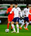 United States' Giovanni Reyna passes the ball during the international friendly soccer match between Wales and USA at Liberty stadium in Swansea, Wales, Thursday, Nov. 12, 2020. (AP Photo/Kirsty Wigglesworth)