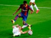 Ferencvaros' Endre Botka, bottom, tries to stop Barcelona's Ansu Fati during the Champions League group G soccer match between FC Barcelona and Ferencvaros at the Camp Nou stadium in Barcelona, Spain, Tuesday, Oct. 20, 2020. (AP Photo/Joan Monfort)