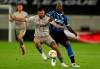 Inter Milan's Romelu Lukaku, right, holds Shakhtar's Davit Khocholava during the Europa League semifinal soccer match between Inter Milan and Shakhtar Donetsk at Dusseldorf Arena, in Duesseldorf, Germany, Monday, Aug. 17, 2020. (Lars Baron/Pool Photo via AP)