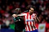 Liverpool's Sadio Mane, left, stops Atletico Madrid's Sime Vrsaljko during a 1st leg, round of 16, of the Champions League soccer match between Atletico Madrid and Liverpool at the Wanda Metropolitano stadium in Madrid, Tuesday, Feb. 18, 2020. (AP Photo/Manu Fernandez)