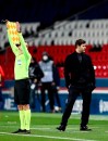 PSG's head coach Mauricio Pochettino looks on during the French League One soccer match between Paris Saint-Germain and Nimes at the Parc des Princes stadium in Paris, France, Wednesday, Feb. 3, 2021. (AP Photo/Michel Euler)
