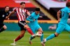 Sheffield United's Sander Berge, left, tries to stop Tottenham's Son Heung-min during the English Premier League soccer match between Sheffield United and Tottenham Hotspur at Bramall Lane in Sheffield, England, Thursday, July 2, 2020. (Oli Scarff/Pool via AP)