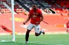 Manchester United's Anthony Martial celebrates after scoring his side's third goal during the English Premier League soccer match between Manchester United and Sheffield United at Old Trafford in Manchester, England, Wednesday, June 24, 2020. (Michael Steele/Pool via AP)