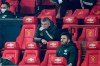 Manchester United's manager Ole Gunnar Solskjaer, center, reacts after Manchester City goal during the English League Cup semifinal soccer match between Manchester United and Manchester City at Old Trafford in Manchester, England, Wednesday, Jan. 6, 2021. (Peter Powell/Pool via AP)