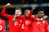 Bayern's Robert Lewandowski, left, celebrates his side's third goal with his teammates during the Champions League round of 16 soccer match between Chelsea and Bayern Munich at Stamford Bridge in London, England, Tuesday, Feb. 25, 2020. (AP Photo/Frank Augstein)