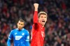 Bayern's Thomas Mueller, right, celebrates after scoring his side's second goal, during the German soccer cup, DFB Pokal, match between FC Bayern Munich and TSG Hoffenheim in Munich, Germany, Wednesday, Feb. 5, 2020. (AP Photo/Matthias Schrader)
