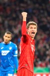 Bayern's Thomas Mueller, right, celebrates after scoring his side's second goal, during the German soccer cup, DFB Pokal, match between FC Bayern Munich and TSG Hoffenheim in Munich, Germany, Wednesday, Feb. 5, 2020. (AP Photo/Matthias Schrader)