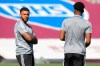 Watford's Andre Gray, left, stands on the pitch before the English Premier League soccer match between Burnley and Watford at the Turf Moor Stadium in Burnley, Thursday, June 25, 2020. (Peter Powell/Pool via AP)