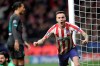 Atletico Madrid's Saul celebrates after scoring his side's first goal during a first leg, round of 16, Champions League soccer match between Atletico Madrid and Liverpool at the Wanda Metropolitano stadium in Madrid, Spain, Tuesday Feb. 18, 2020. (AP Photo/Bernat Armangue)
