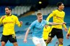 Manchester City's Kevin De Bruyne, center, celebrates after scoring his side's first goal during the Champions League, first leg, quarterfinal soccer match between Manchester City and Borussia Dortmund at the Etihad stadium in Manchester, Tuesday, April 6, 2021. (AP Photo/Dave Thompson)