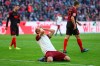 Bayern's Thomas Mueller covers his face after missing an opportunity to score during the German Bundesliga soccer match between FC Bayern Munich and FC Augsburg in Munich, Germany, Sunday, March 8, 2020. (AP Photo/Matthias Schrader)