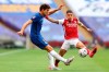 Chelsea's Marcos Alonso, left, challenges for the ball with Arsenal's Hector Bellerin during the FA Cup final soccer match between Arsenal and Chelsea at Wembley stadium in London, England, Saturday, Aug.1, 2020. (Catherine Ivill/Pool via AP)