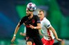 Atletico Madrid's Yannick Carrasco, left, challenges for the ball with Leipzig's Lukas Klostermann during the Champions League quarterfinal match between RB Leipzig and Atletico Madrid at the Jose Alvalade stadium in Lisbon, Portugal, Thursday, Aug. 13, 2020. (Miguel A. Lopes/Pool Photo via AP)