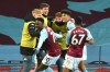 Aston Villa's players celebrate a goal by Aston Villa's Louie Barry during the FA Cup 3rd round soccer match between Aston Villa and Liverpool at Villa Park stadium in Birmingham, England, Friday, Jan. 8, 2021. (AP Photo/Rui Vieira)