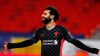 Liverpool's Mohamed Salah celebrates after scoring his side's first goal during the Champions League round of 16, first leg, soccer match between RB Leipzig and Liverpool at the Ferenc Puskas stadium in Budapest, Hungary, Tuesday, Feb. 16, 2021. (AP Photo/Laszlo Balogh)