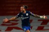 Southampton's Theo Walcott celebrates after scoring his side's first goal during an English Premier League soccer match between Arsenal and Southampton at the Emirates stadium in London, England, Wednesday, Dec. 16, 2020. (Adrian Dennis/Pool via AP)