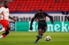 Liverpool's Sadio Mane scores his side's second goal during the Champions League round of 16, first leg, soccer match between RB Leipzig and Liverpool at the Ferenc Puskas stadium in Budapest, Hungary, Tuesday, Feb. 16, 2021. (AP Photo/Laszlo Balogh)