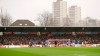 Spectators watch from the stands of Griffin Park stadium, inaugurated in 1904, during the English FA Cup fourth round soccer match between Brentford FC and Leicester City at Griffin Park stadium in London, Saturday, Jan. 25, 2020. (AP Photo/Kirsty Wigglesworth)