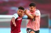 Sheffield United's John Egan, right, challenges for the ball with Aston Villa's Ollie Watkins during the English Premier League soccer match between Aston Villa and Sheffield United at the Villa Park stadium in Birmingham, Monday, Sept. 21, 2020. (Clive Rose/Pool via AP)