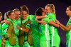 Wolfsburg players celebrate at the end of the Women's Champions League semifinal soccer match between Wolfsburg and Barcelona in San Sebastian, Spain, Tuesday, Aug. 25, 2020.(AP Photo/Gabriel Bouys)