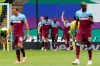 West Ham's Michail Antonio, center, celebrates after scoring his side's third goal during the English Premier League soccer match between Norwich City and West Ham at the Carrow Road stadium in Norwich, England, Saturday, July 11, 2020. (Tim Keeton/Pool via AP)