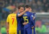 Team mates hug Sweden's Alexander Isak after referee Daniele Orsato briefly stopped the game following alleged racist chants against the player during the Euro 2020 group F qualifying soccer match between Romania and Sweden on the National Arena stadium in Bucharest, Romania, Friday, Nov. 15, 2019. (AP Photo/Vadim Ghirda)