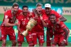 Bayern Munich players celebrate with the trophy after winning the German soccer cup (DFB Pokal) final match between Bayer 04 Leverkusen and FC Bayern Munich in Berlin, Germany, Saturday, July 4, 2020. (AP Photo/Michael Sohn)