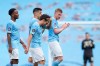 Manchester City's David Silva is applauded by team mates at the end of the English Premier League soccer match between Manchester City and Norwich City at the Etihad Stadium in Manchester, England, Sunday, July 26, 2020. (AP Photo/Dave Thompson, Pool)