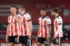 Sheffield United's players celebrate after the English Premier League soccer match between Sheffield United and Newcastle United at the Bramall Lane stadium in Sheffield, England, Tuesday, Jan. 12, 2021. (Oli Scarff/Pool via AP)