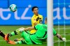 Dortmund's Jude Bellingham, right, fails to score next to Leverkusen's goalkeeper Lukas Hradecky during the German Bundesliga soccer match between Bayer Leverkusen and Borussia Dortmund in Leverkusen, Germany, Tuesday, Jan. 19, 2021. (AP Photo/Martin Meissner, Pool)