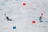 Norway's Fabian Wilkens Solheim, right, and Sweden's Mattias Roenngren speed down the course during a mixed team parallel slalom, at the alpine ski World Championships, in Cortina d'Ampezzo, Italy, Wednesday, Feb. 17, 2021. (AP Photo/Gabriele Facciotti)