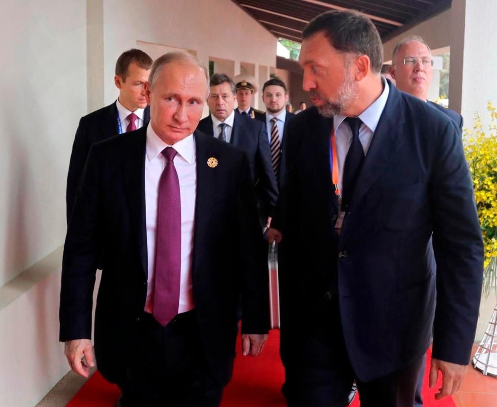 Mikhail Klimentyev - AP
Oleg Deripaska (right), a metals magnate who is reportedly close to Russian President Vladimir Putin, holds a minority stake in Strabag, the lead company on a team the Ontario government selected in May 2021 to design and dig the tunnels for the Scarborough subway.