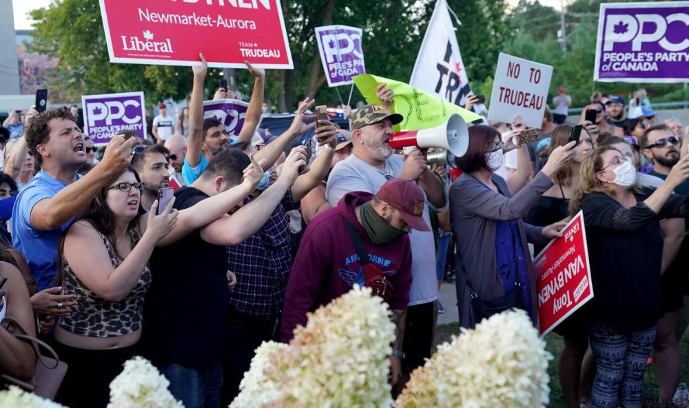 Nathan Denette - THE CANADIAN PRESS
Protesters and People's Party of Canada supporters jeer at Liberal Leader Justin Trudeau as he arrives to a Sept. 5 Liberal Party campaign event in Newmarket, Ont.