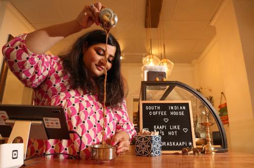 Steve Russell - Toronto Star
Madras Kaapi co-owner Shilpa Kotamarthi aerates kaapi using a davara. Below right, Cà phê trúng (egg coffee) from Dak Lak.
