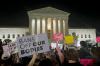 Anna Johnson - The Associated Press
A crowd of people gather outside the Supreme Court, Monday night in Washington. A draft opinion circulated among Supreme Court justices suggests that earlier this year a majority of them had thrown support behind overturning the 1973 case Roe v. Wade that legalized abortion nationwide, according to a report published Monday night in Politico.