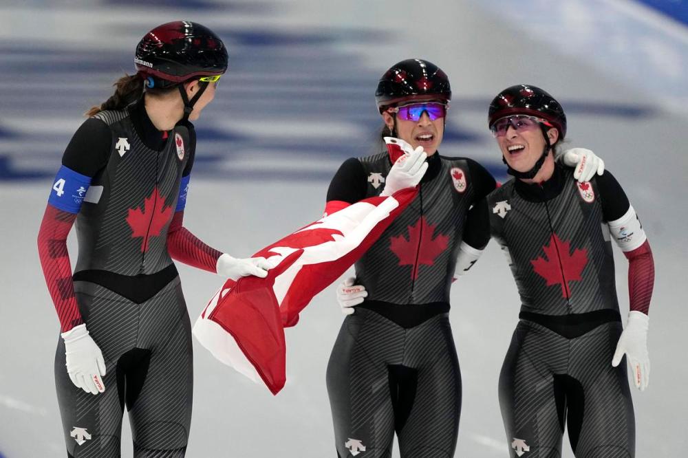 Ashley Landis - The Associated Press
Team Canada, with Isabelle Weidemann left, Valerie Maltais center and Ivanie Blondin, react after wining the gold medal and setting an Olympic record in the speedskating women's team pursuit finals at the 2022 Winter Olympics, Tuesday, Feb. 15, 2022, in Beijing.