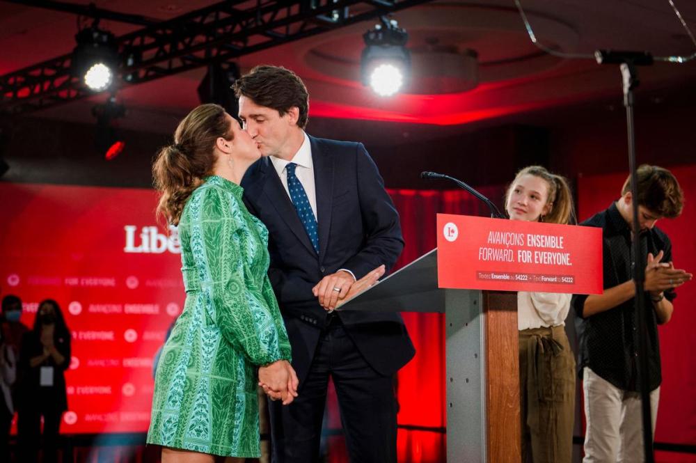 ANDREJ IVANOV - AFP via GETTY IMAGES
Prime Minister Justin Trudeau kisses his wife Sophie Grégoire-Trudeau next to their children Ella-Grace and Xavier, before delivering his victory speech in Montreal late on election night.