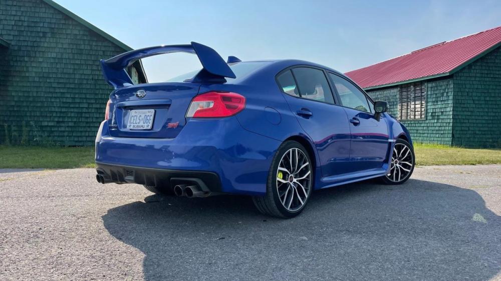STI purchasers can opt for either a wing spoiler (shown) or a more discreet lip spoiler.