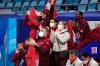 David J. Phillip - AP
The team cheers for Piper Gilles and Paul Poirier, of Canada, during the ice dance team program in the figure skating competition at the 2022 Winter Olympics, Friday, Feb. 4, 2022, in Beijing.