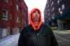 Kelly Brown stands by the apartment building he helped pull people out of during a fire at 485 Furby on Monday. (Daniel Crump / Winnipeg Free Press)