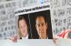 JASON REDMOND - AFP via Getty Images
A demonstrator holds a photo of detained Canadians Michael Spavor, left, and Michael Kovrig outside a court appearance for Huawei Chief Financial Officer, Meng Wanzhou at the British Columbia Supreme Court in Vancouver in 2019.