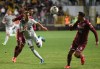 Maxi Urruti of Canada's Montreal Impact (37) chases the ball as midfielder David Guzman, right, of Costa Rica's Deportivo Saprissa looks on during a CONCAFAF Champions League soccer match at the Ricardo Saprissa Stadium in San Jose, Costa Rica, Wednesday, Feb. 19, 2020. (AP Photo/Carlos Gonzalez)
